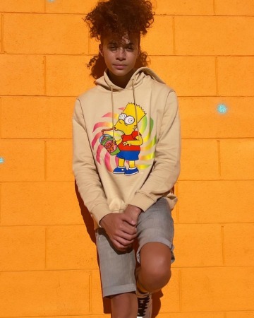 Jaylin Fletcher is posing for the photo.